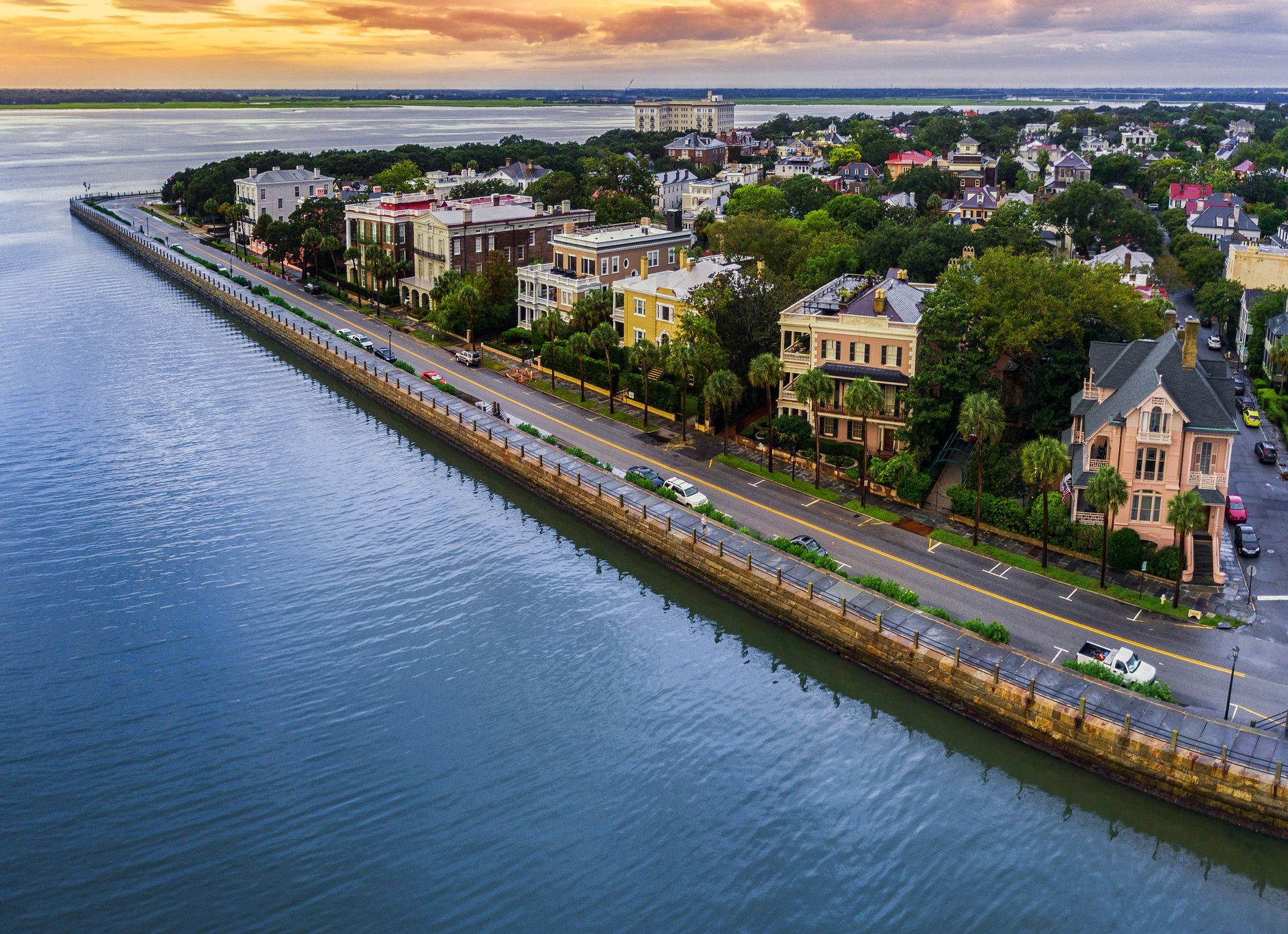 Historic homes along the Battery seawall in Charleston at sunset