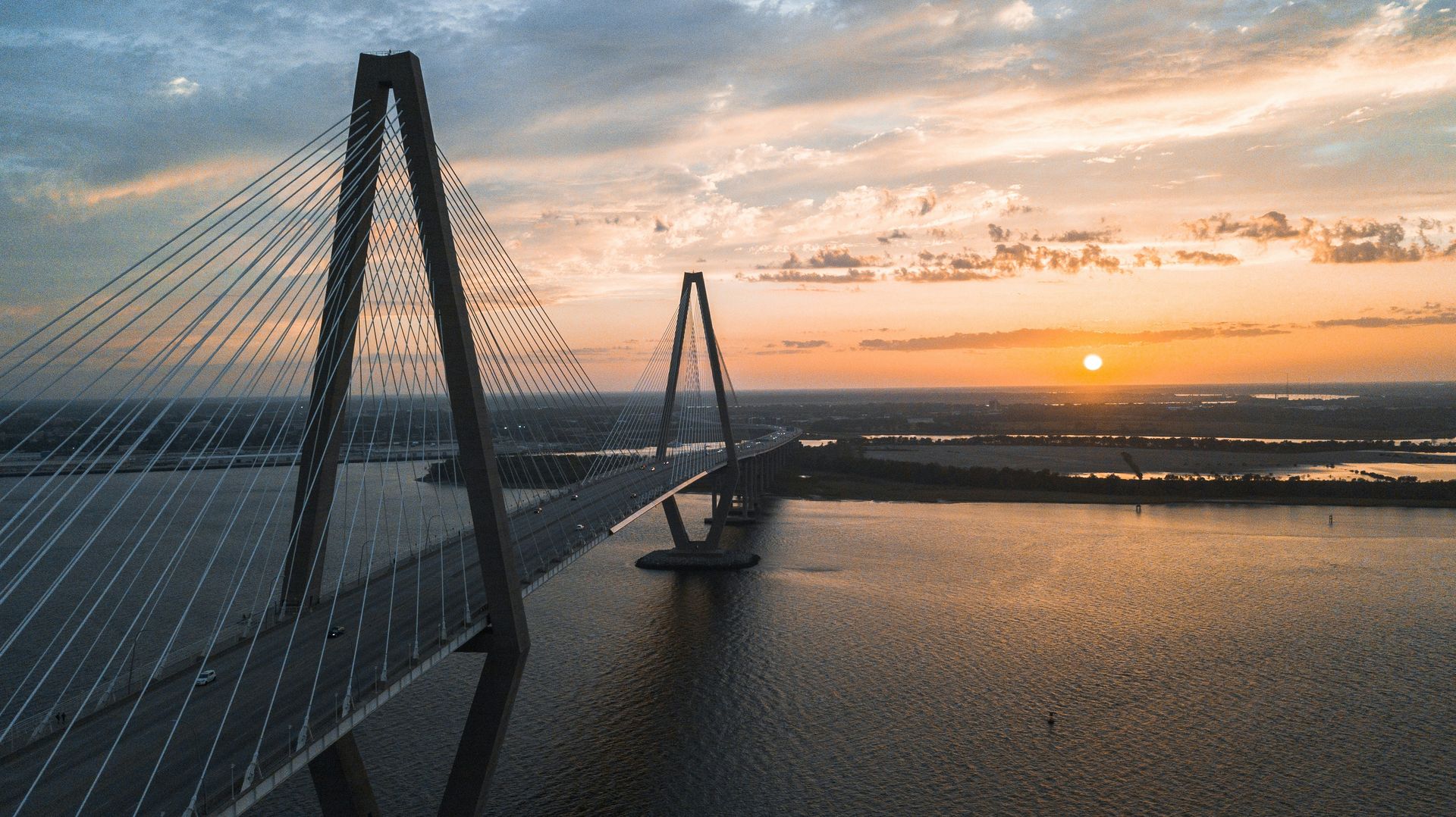 The Ravenel Bridge over Charleston Harbor at sunset