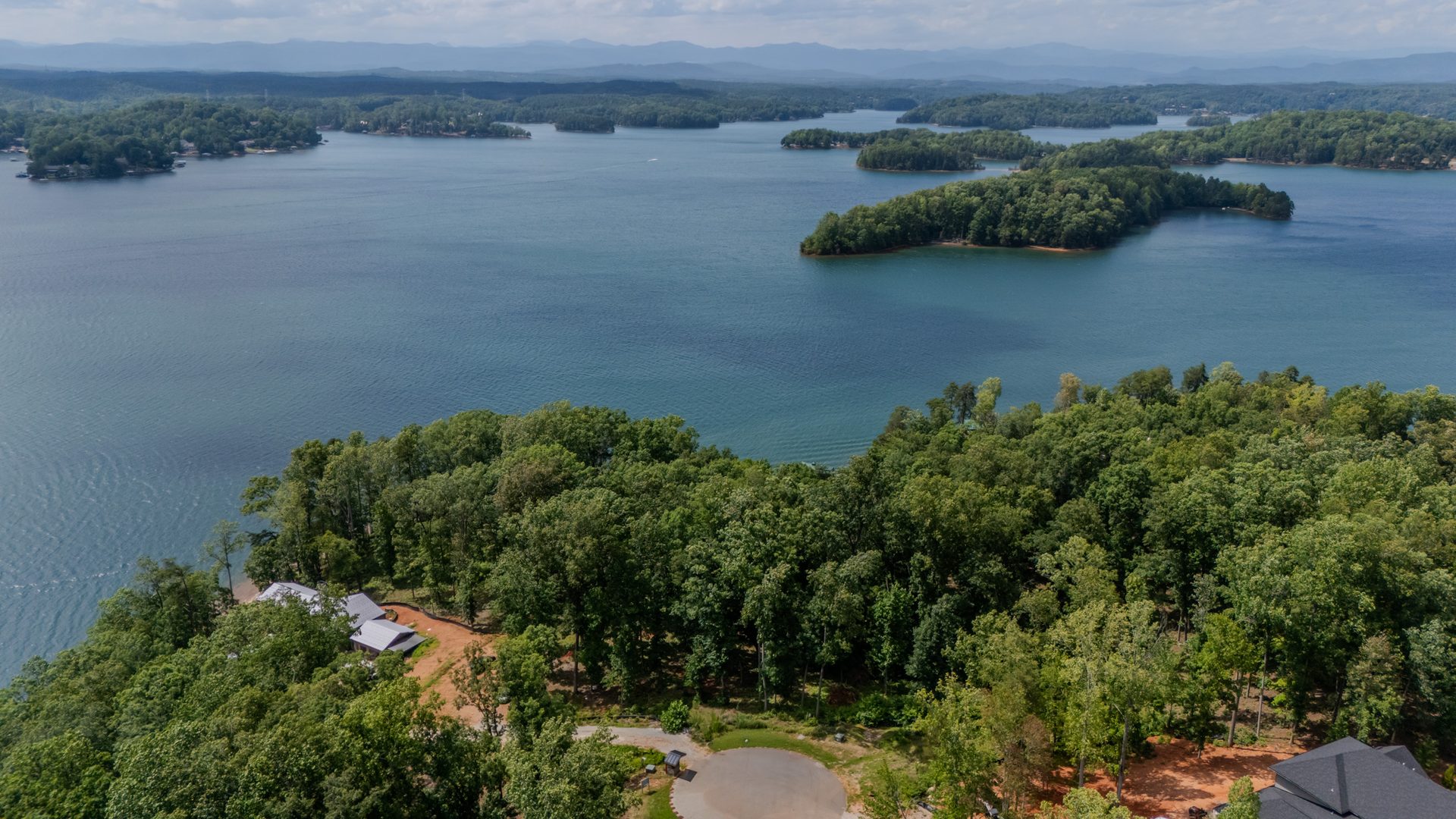 The first Ground Up site on the water at The Cliffs at Lake Keowee, Blue Ridge beyond