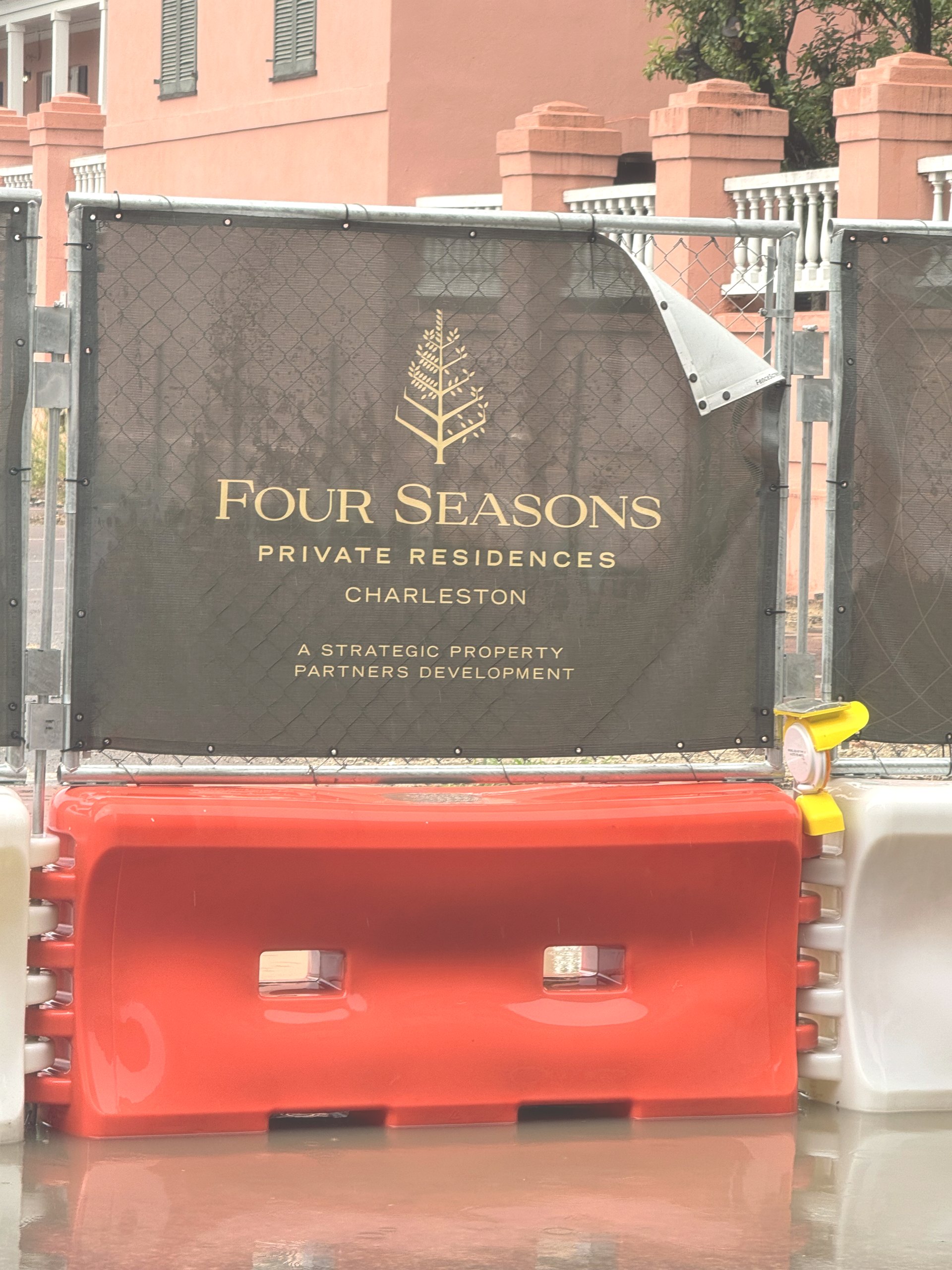 A Four Seasons Private Residences Charleston construction hoarding at the 155 Meeting Street site