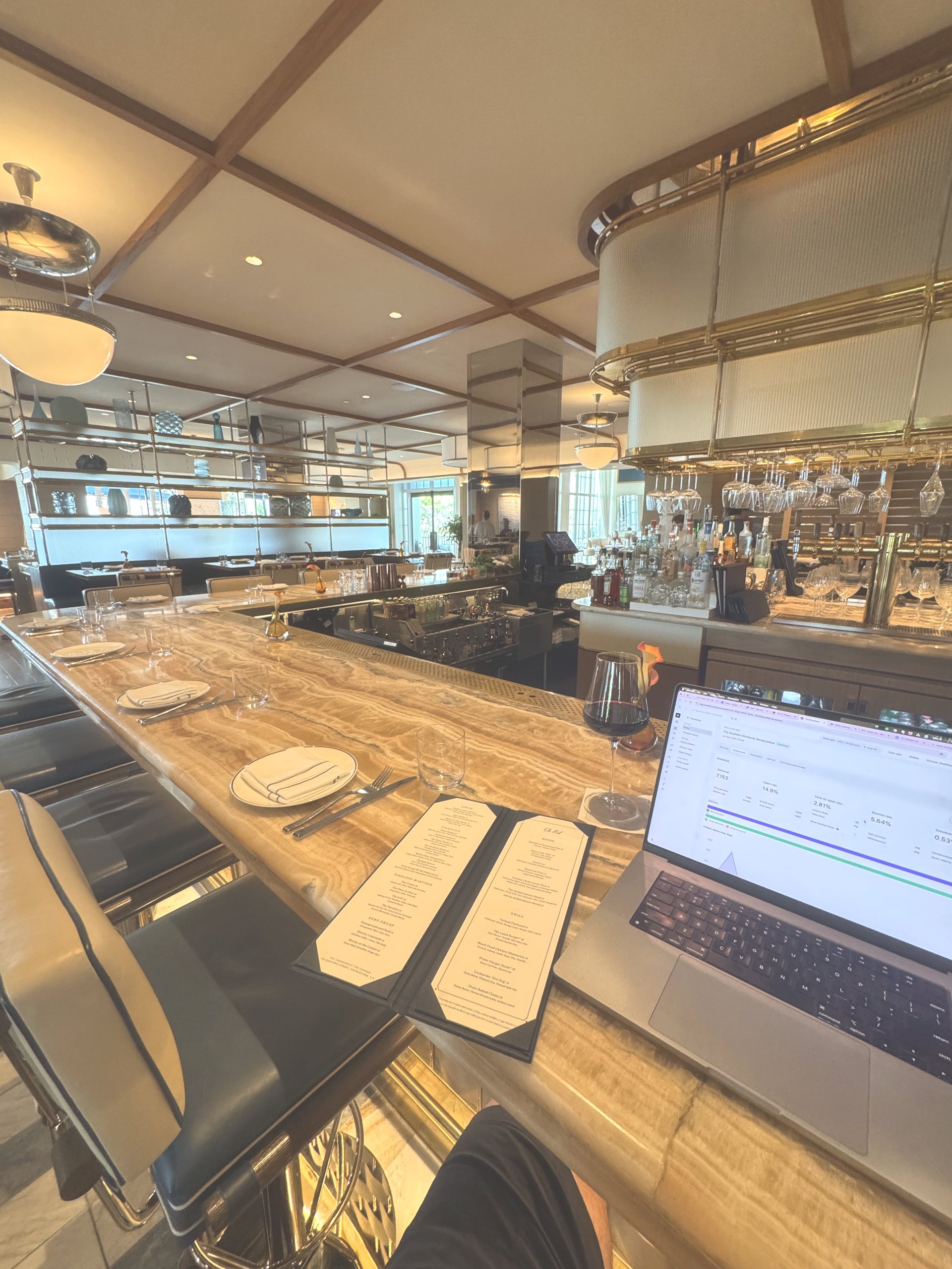 The long wooden bar at The Crossing inside The Cooper hotel in Charleston
