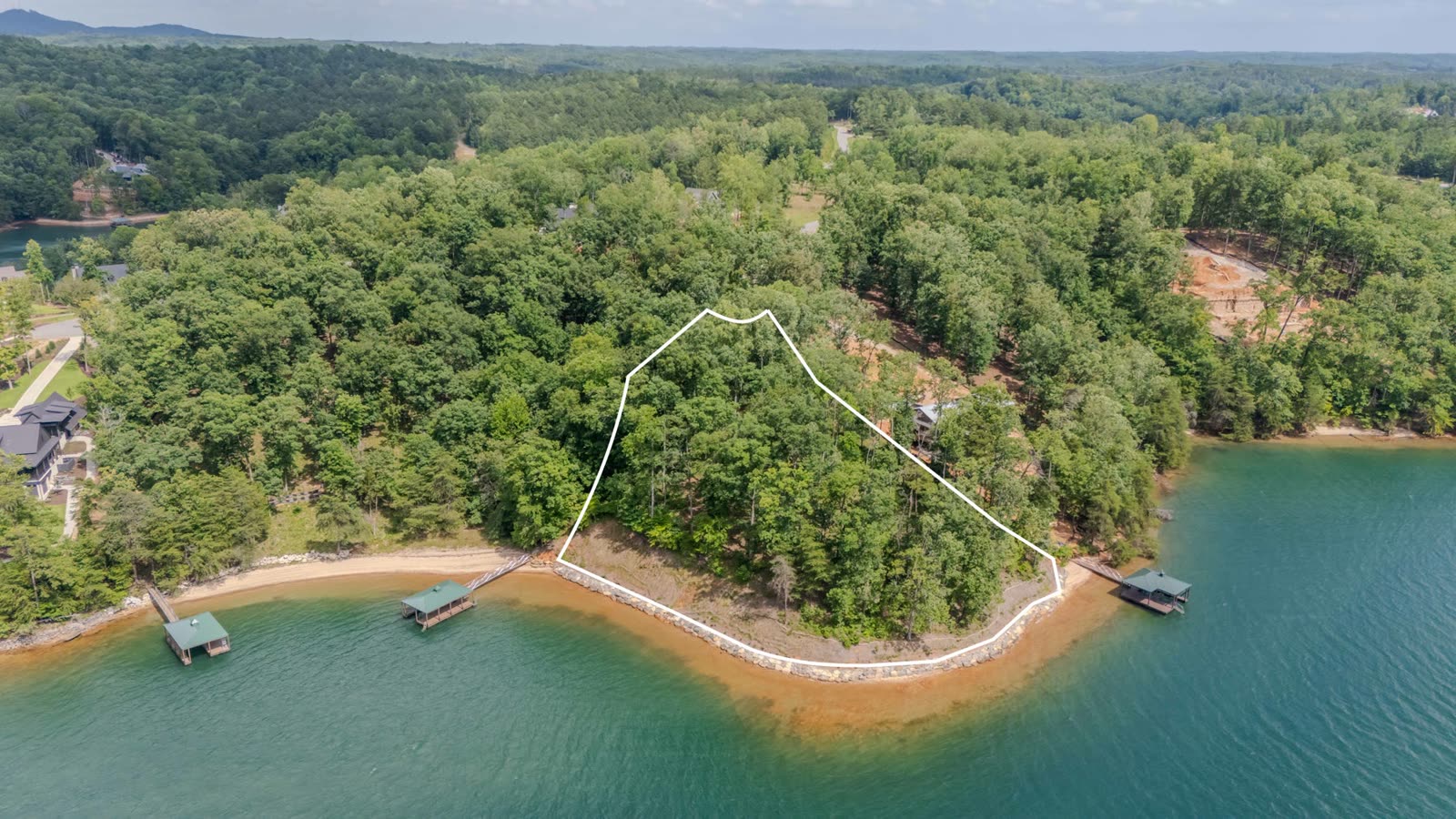 Aerial photograph of the 233 Sandy Hollow Court shoreline from the south, parcel outlined