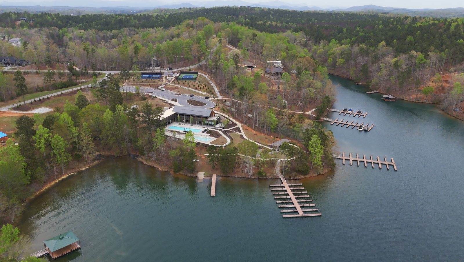Aerial of the lake club at The Landing, The Cliffs at Keowee Springs, with pools, courts and boat slips