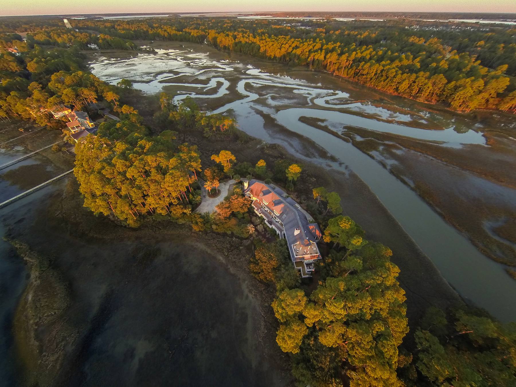 Kiawah Island at golden hour, an oceanfront estate above the tidal creeks