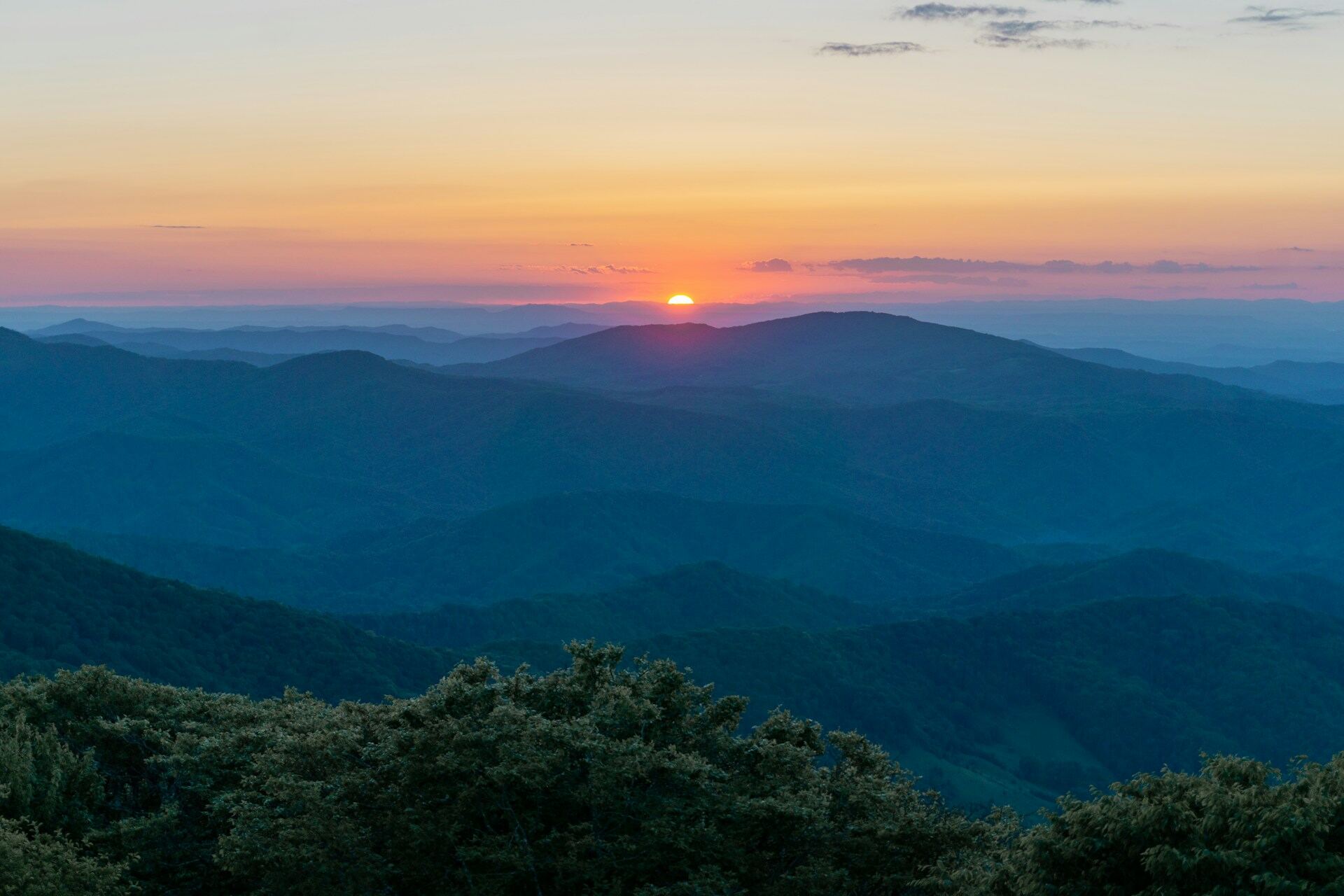 Layered Blue Ridge ridgelines receding into haze at first light