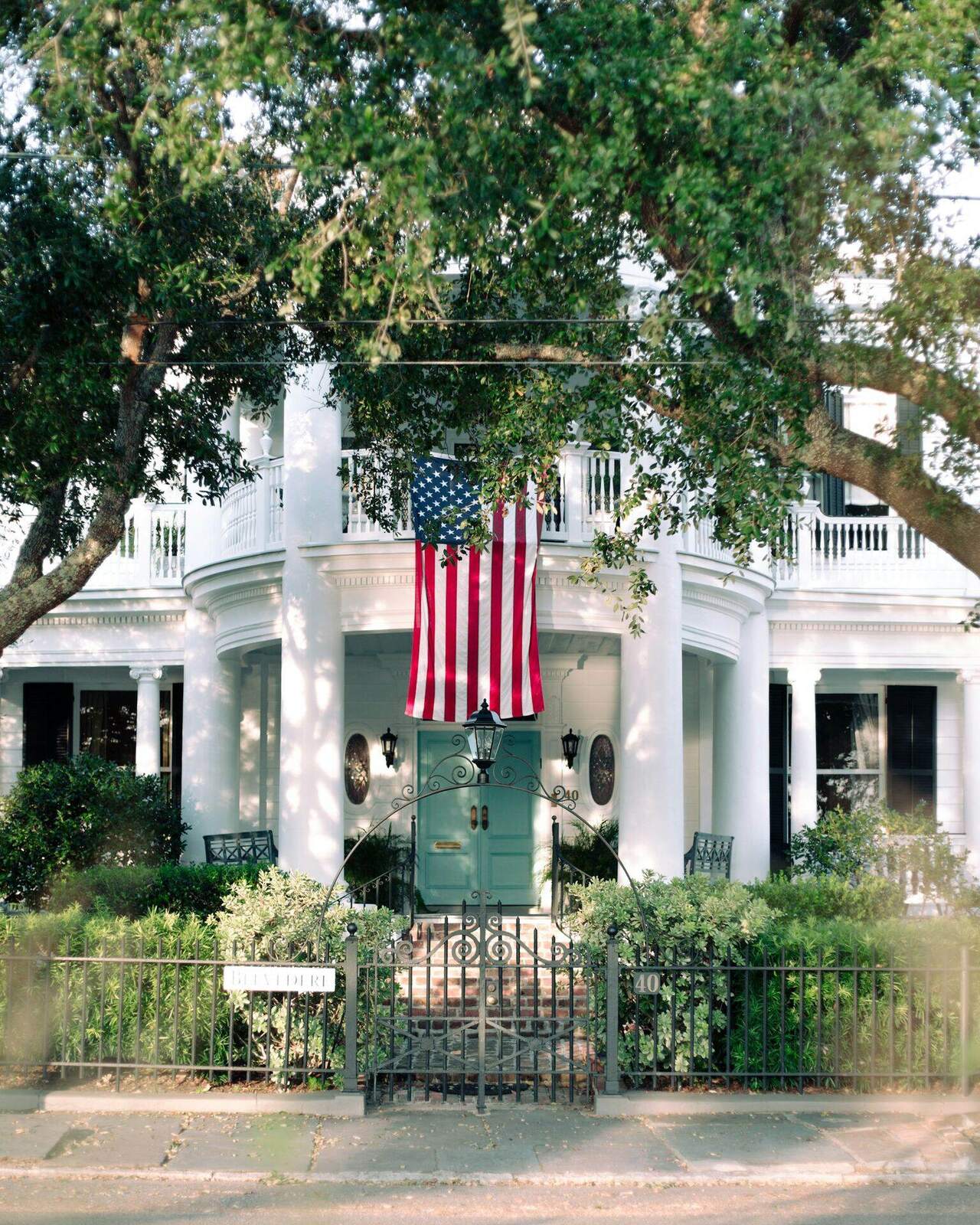 A Charleston single house on the Battery, flag over the piazza