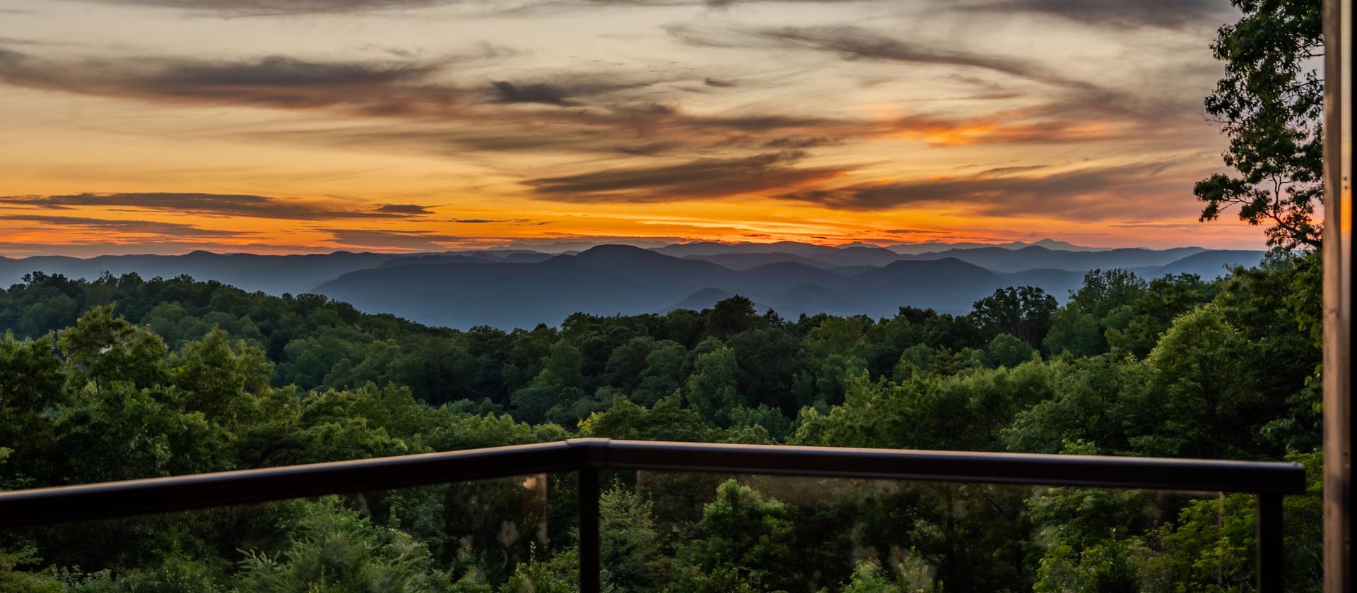 Sunset over the Blue Ridge from a deck at The Cliffs at Glassy