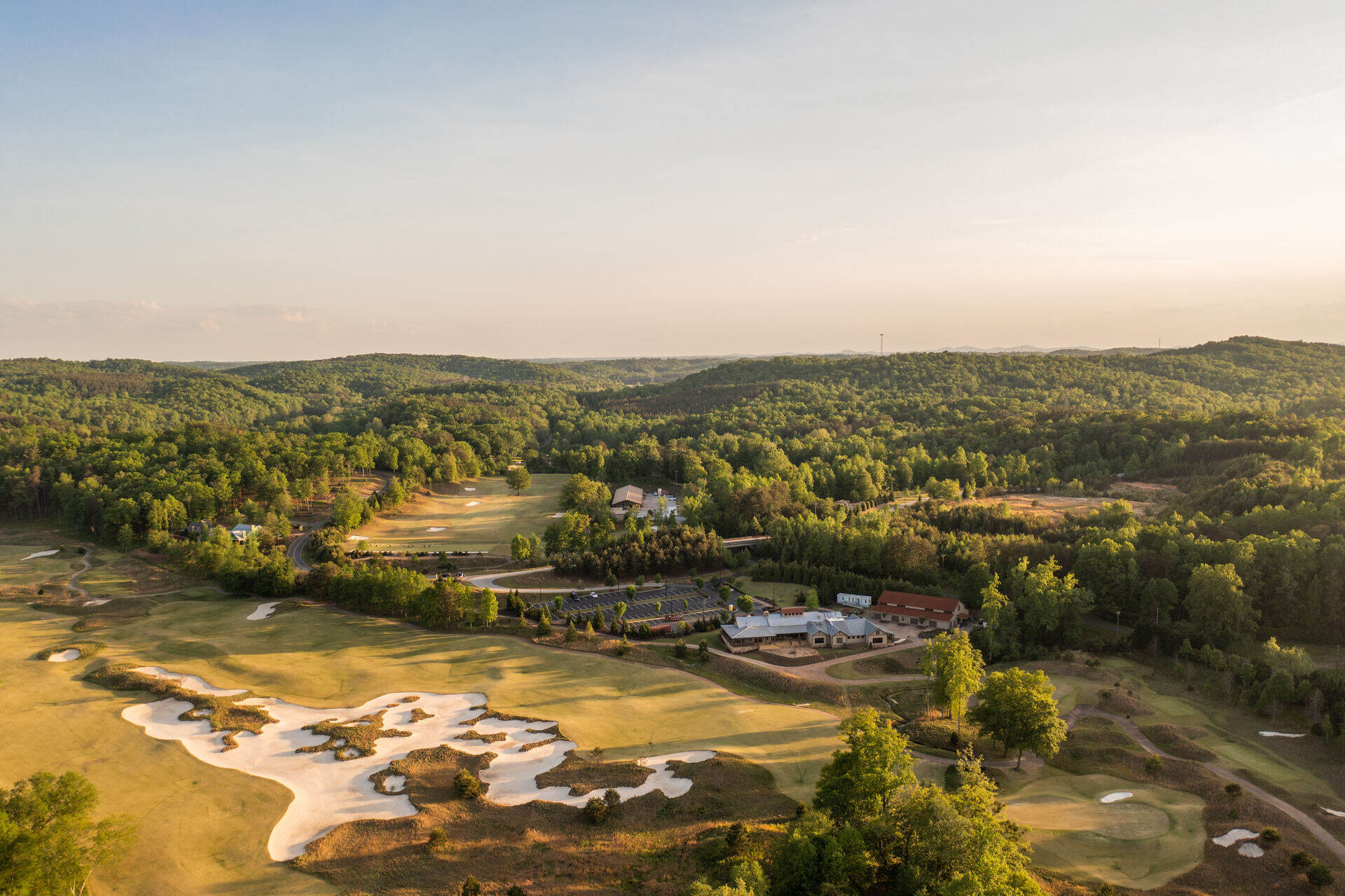 The course at Cliffs Mountain Park from the air, bunkering and fairways in late light