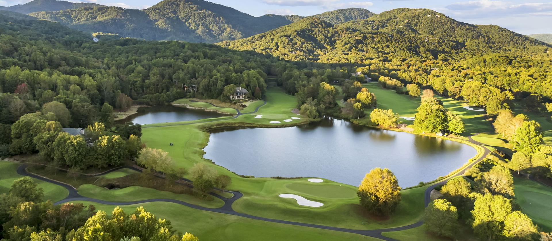 The Cliffs Valley course and its lakes from the air, the mountains rising behind