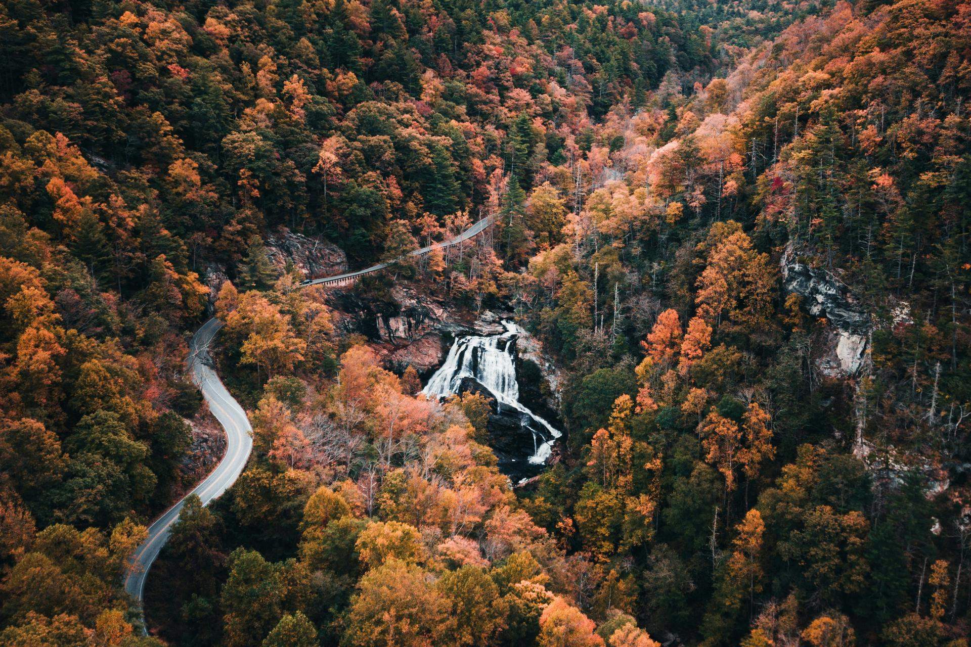 US 64 winding through autumn color outside Highlands