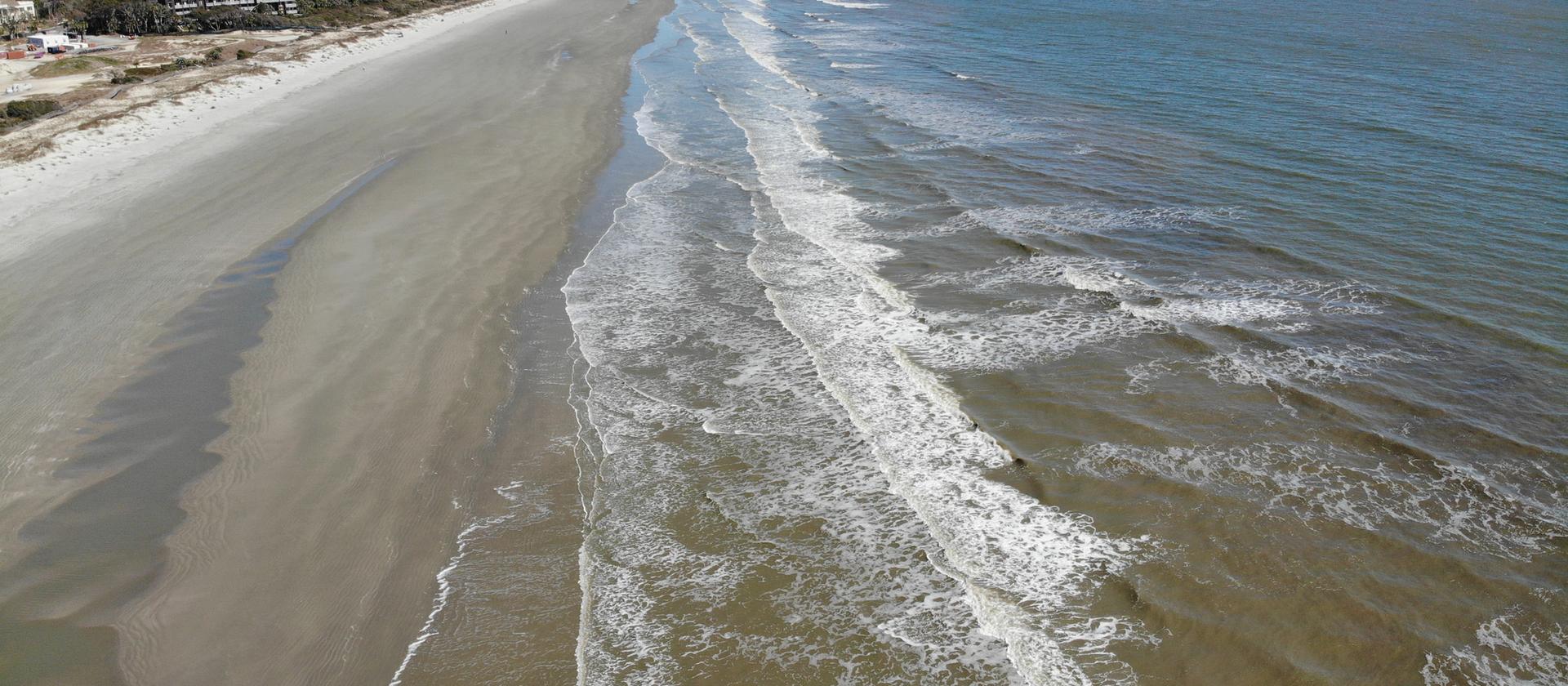 Aerial view of the wide, flat Atlantic beach on Kiawah Island