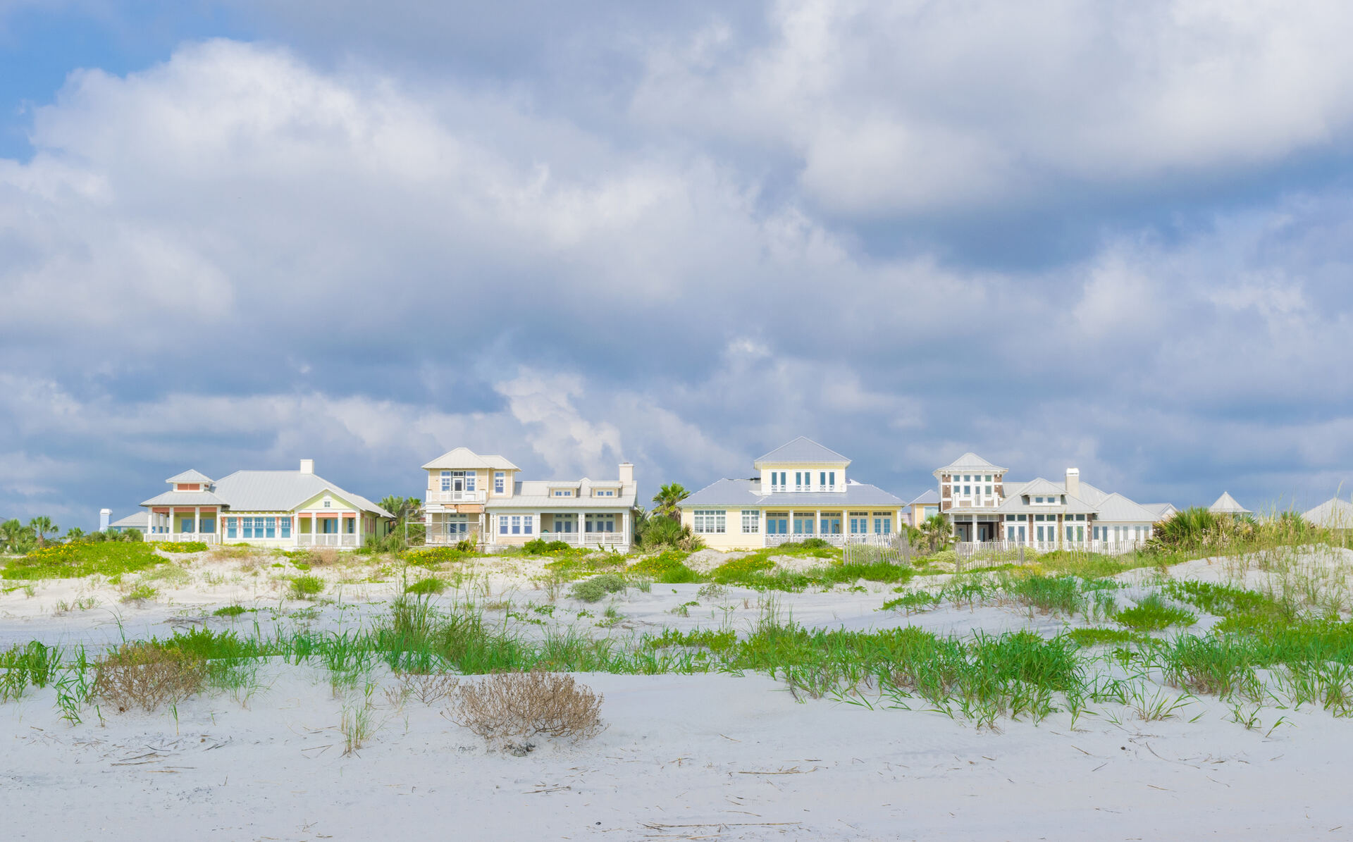 Beach cottages set back behind the dune line