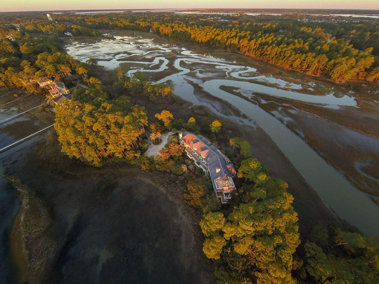 Lowcountry marsh and tidal creeks from the air, autumn colour in the treelines